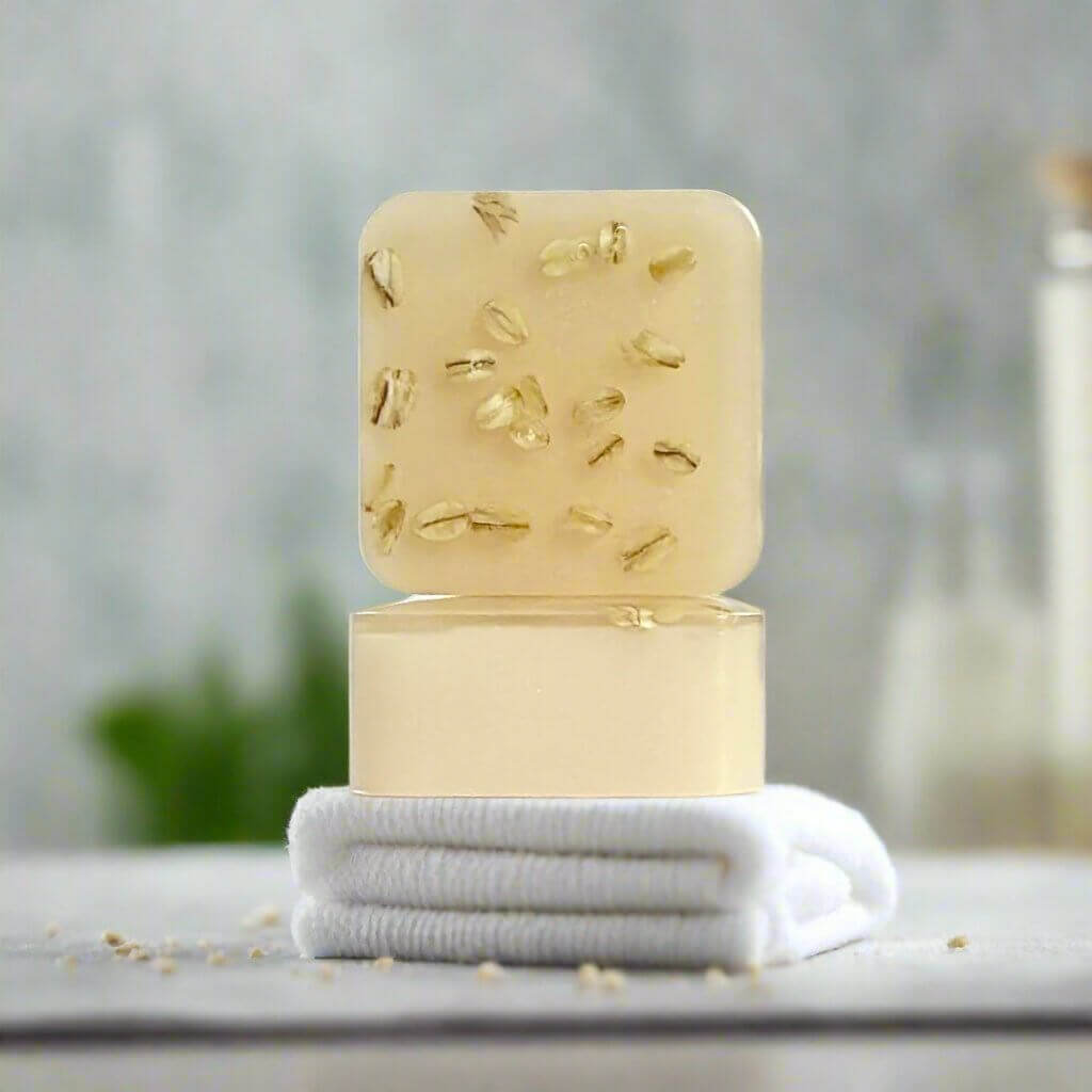 Harmony Honey Cream soap sitting up on a folded towel on a bathroom counter.