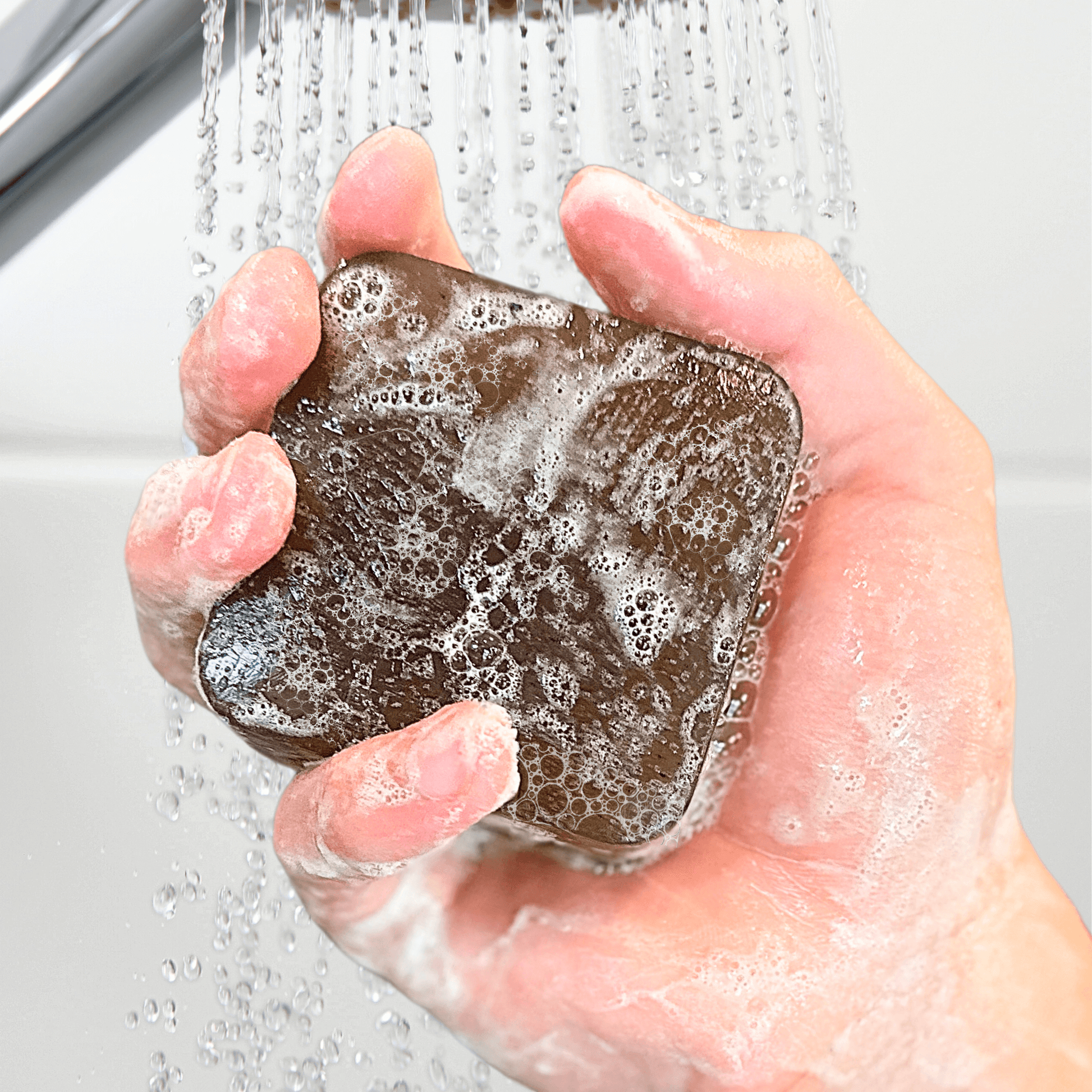 New Ergonomic-Friendly Natural Soap Lathered Up In Hand Front Side