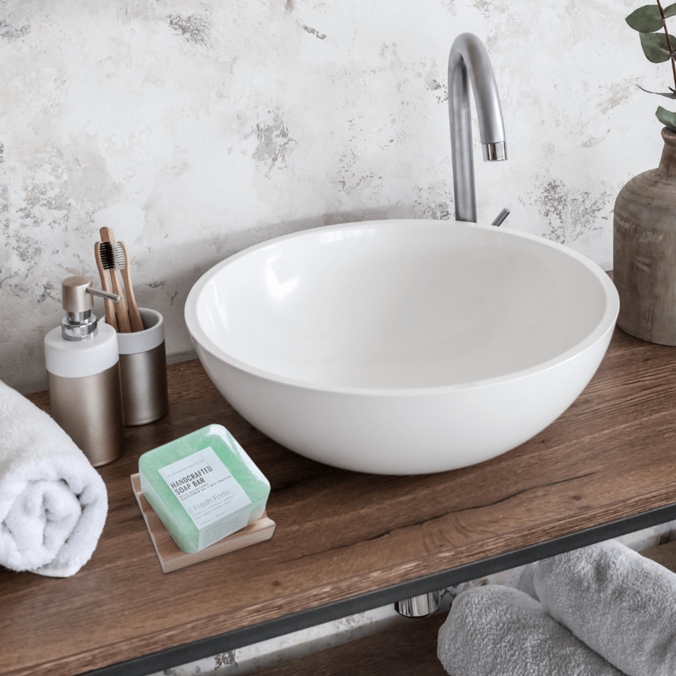 Fresh Forte Handcrafted Soap bar sitting on our Ridged Soap Saver Dish on a wooden bathroom counter.